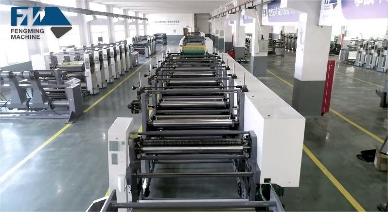 Sistema de guía web y carga/descarga automática para la máquina de impresión de tipo unitario